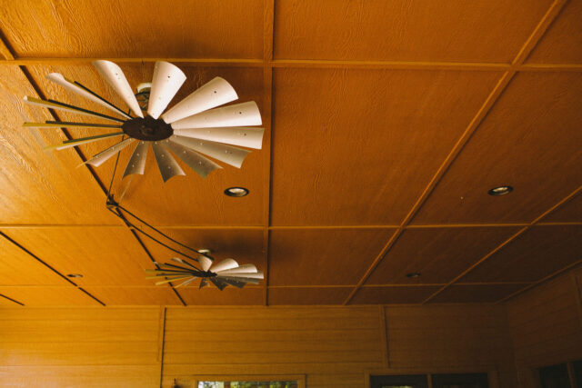 outdoor fans on the ceiling of a covered patio