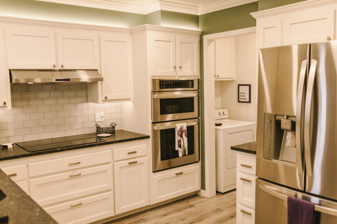 white cabinets and countertop stove
